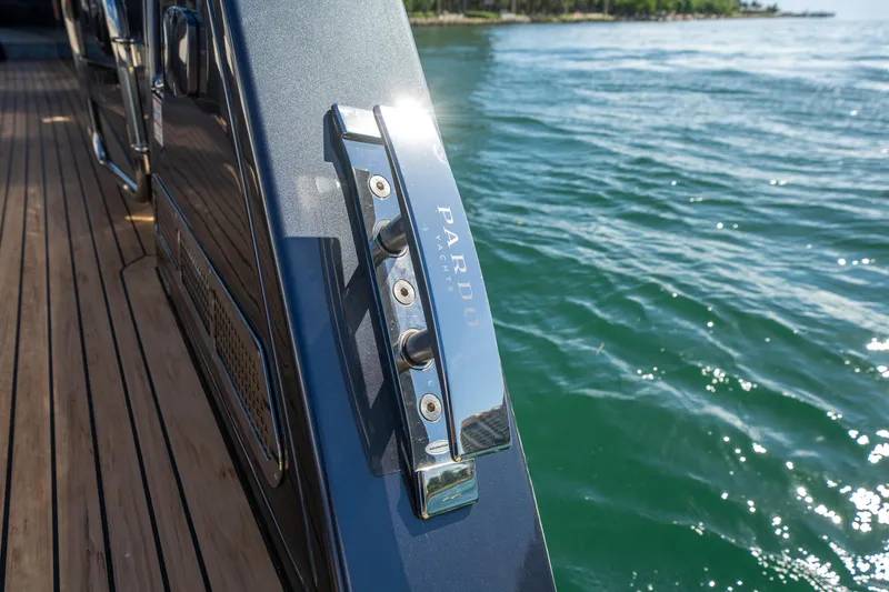 Slide: The Image of 2023 Pardo Yachts 43, sleek design, docked on calm waters. - 9