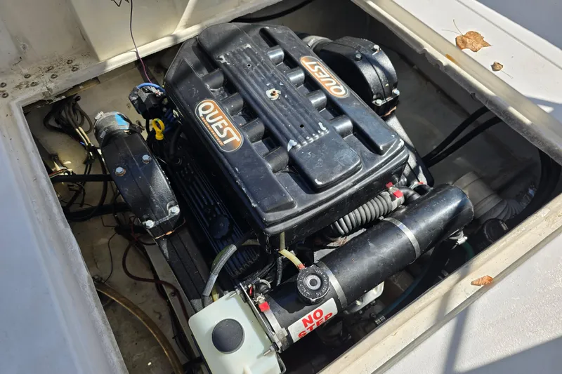 Slide: The Image of Engine compartment of a 1984 Bayliner 2802 Trophy boat, featuring a Quest LS7 engine. - 10
