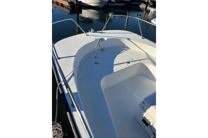 Slide: The Image of 2017 Boston Whaler 190 Montauk boat deck, docked in marina. - 7