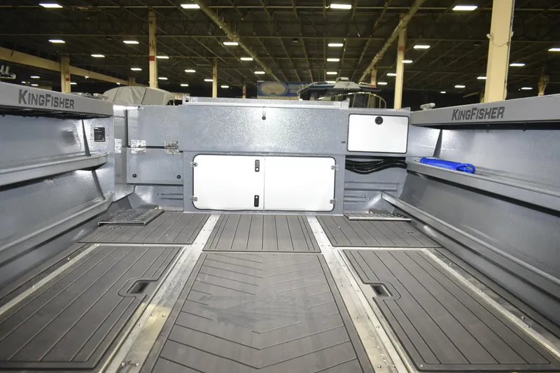 Slide: The Image of Interior view of 2026 KingFisher 2825 Coastal Express boat, showcasing spacious deck and storage. - 15