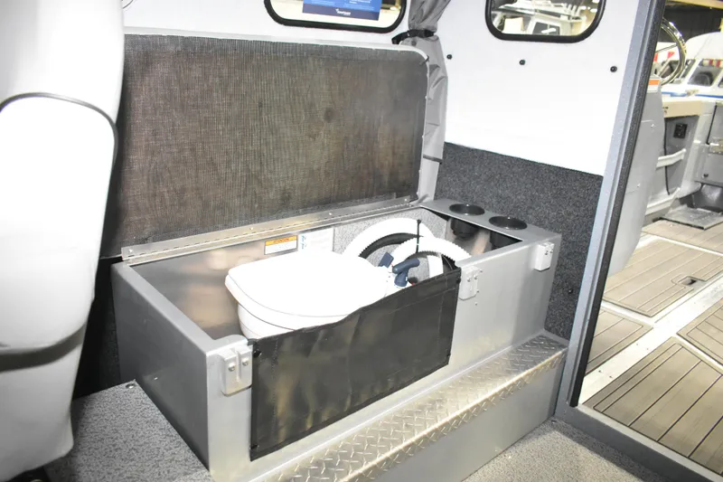 Slide: The Image of Interior of 2026 KingFisher 2825 Coastal Express with built-in storage compartment. - 25