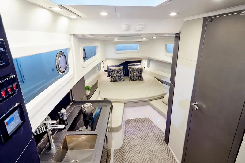 Slide: The Image of Luxurious interior of 2026 Schaefer Yachts V44, featuring modern kitchen and cozy seating area. - 10