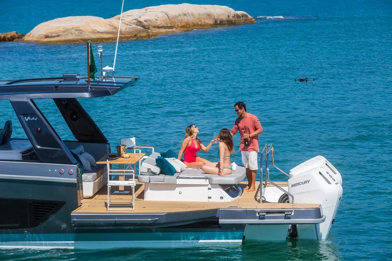 Slide: The Image of 2026 Schaefer Yachts V44 with people enjoying a sunny day on the water. - 7