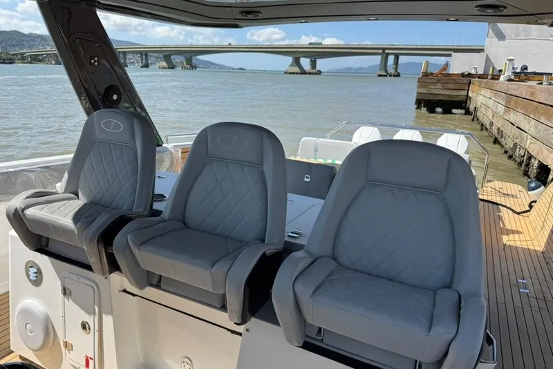 Slide: The Image of Luxury seating on 2026 Schaefer Yachts V44, docked with scenic bridge view. - 9