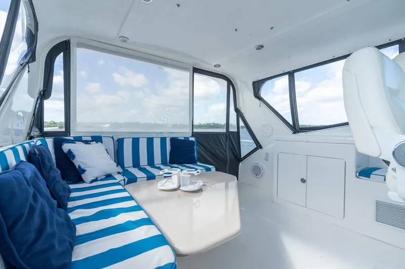 Slide: The Image of Luxurious interior of 2009 Pacific Mariner 65 Motoryacht with striped seating and scenic views. - 14