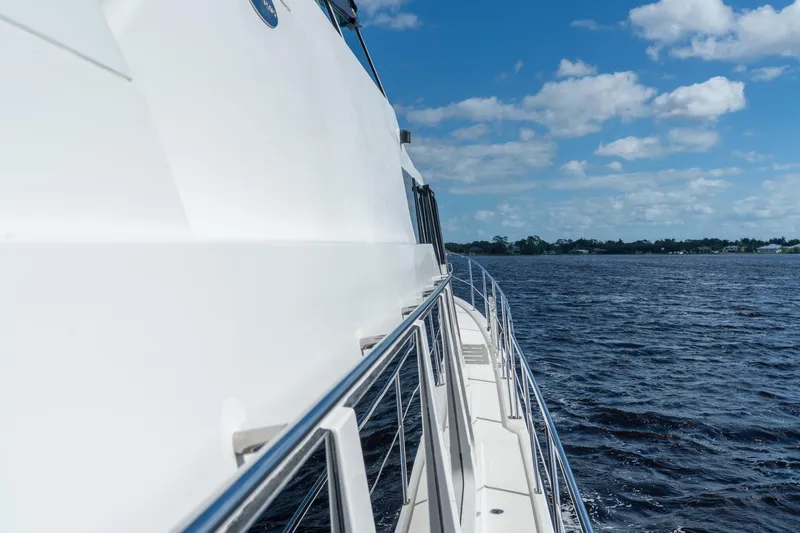 Slide: The Image of 2009 Pacific Mariner 65 Motoryacht cruising on a sunny day with blue skies. - 18