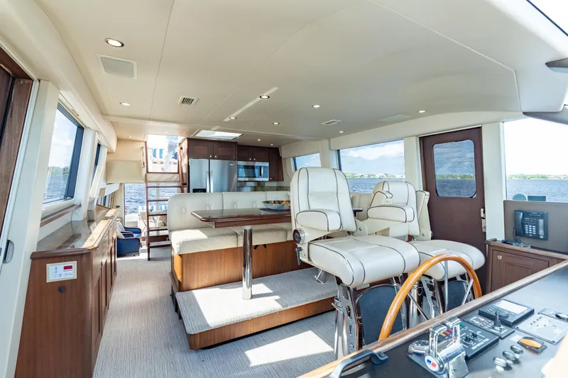 Slide: The Image of Luxurious interior of 2009 Pacific Mariner 65 Motoryacht with modern seating and navigation controls. - 29
