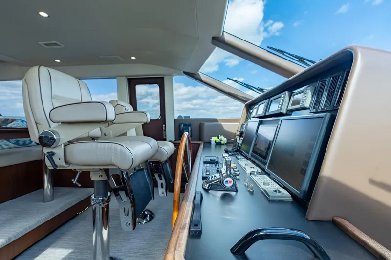 Slide: The Image of Luxurious helm of 2009 Pacific Mariner 65 Motoryacht with modern navigation equipment. - 32