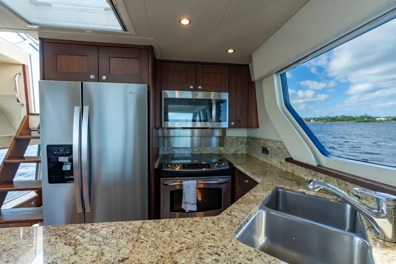 Slide: The Image of Luxurious kitchen interior of 2009 Pacific Mariner 65 Motoryacht with stainless steel appliances. - 35