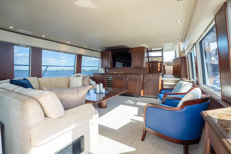 Slide: The Image of Luxurious interior of 2009 Pacific Mariner 65 Motoryacht with elegant seating and panoramic windows. - 41