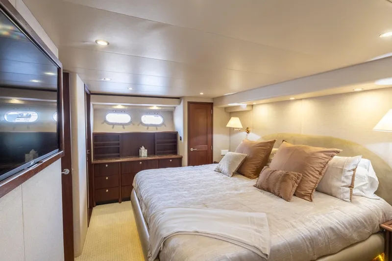 Slide: The Image of Luxurious bedroom interior of 2009 Pacific Mariner 65 Motoryacht with elegant bedding and wood accents. - 43