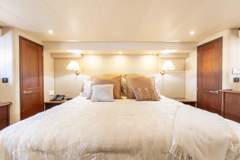 Slide: The Image of Luxurious bedroom interior of 2009 Pacific Mariner 65 Motoryacht with elegant bedding and lighting. - 45