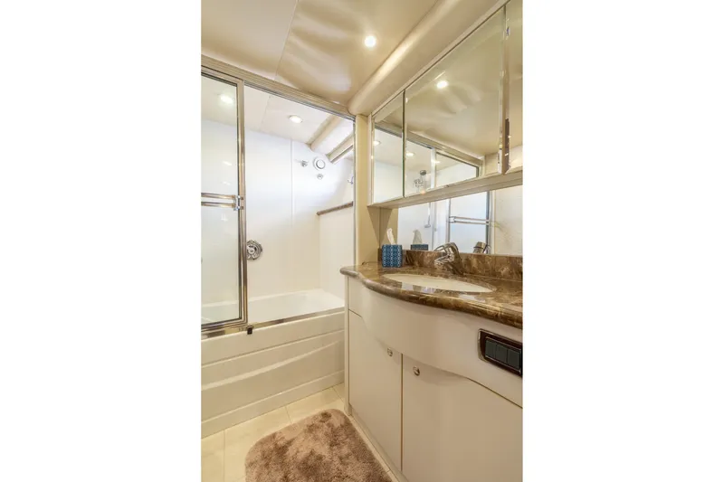 Slide: The Image of Luxurious bathroom in 2009 Pacific Mariner 65 Motoryacht with marble countertop and shower. - 47