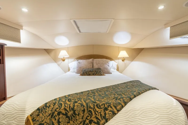 Slide: The Image of Luxurious bedroom interior of 2009 Pacific Mariner 65 Motoryacht with elegant bedding and lighting. - 50