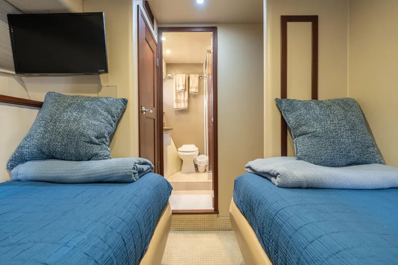 Slide: The Image of 2009 Pacific Mariner 65 Motoryacht cabin with twin beds and ensuite bathroom. - 52