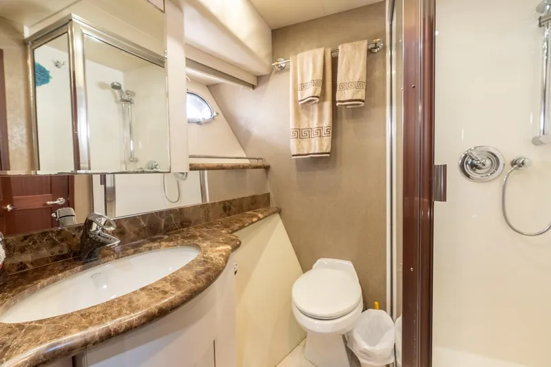 Slide: The Image of Luxurious bathroom in 2009 Pacific Mariner 65 Motoryacht with marble countertop and shower. - 55