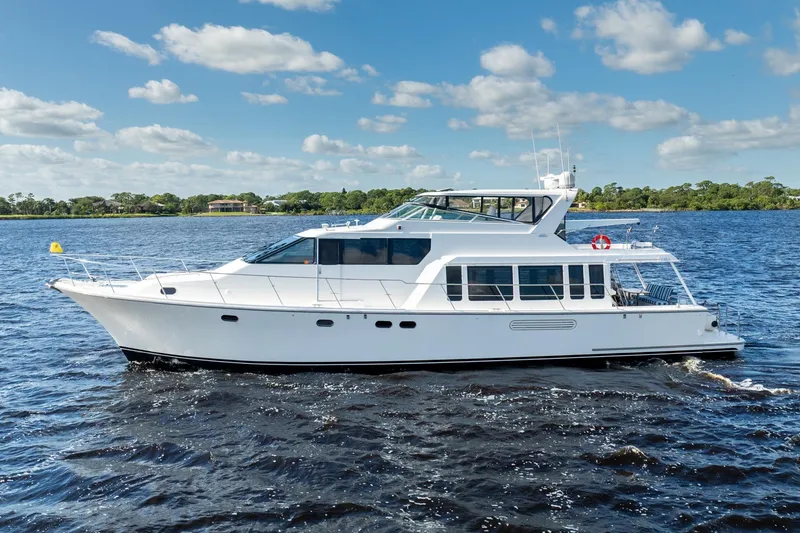 Slide: The Image of 2009 Pacific Mariner 65 Motoryacht cruising on a sunny day with blue skies. - 9