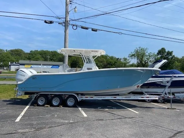 The Image of 2022 Sea Fox 288 Commander boat on a trailer in a parking lot. - 0