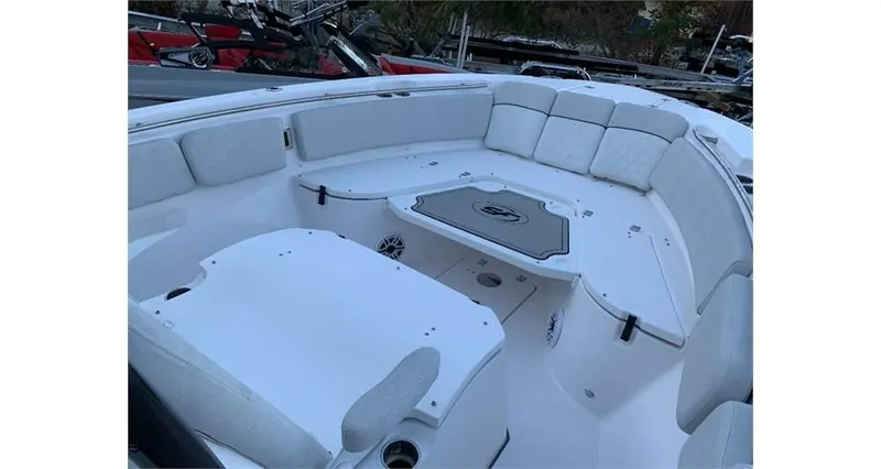 Slide: The Image of 2022 Sea Fox 288 Commander boat interior with cushioned seating and table. - 5