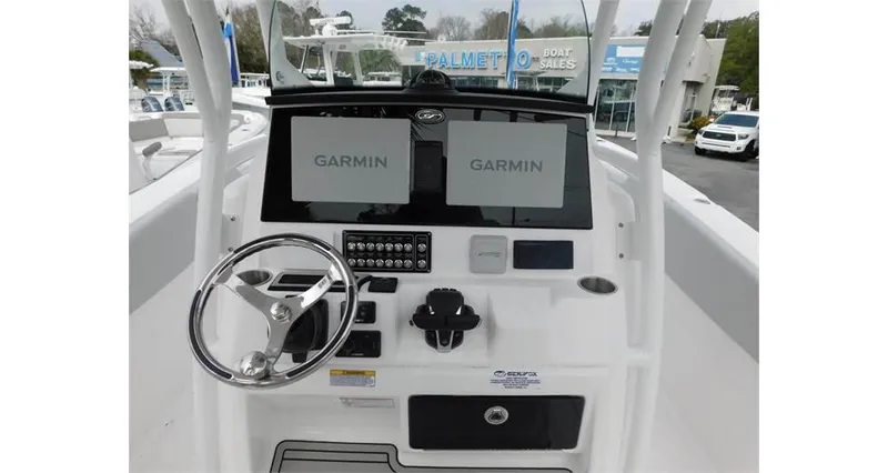 Slide: The Image of 2022 Sea Fox 288 Commander boat dashboard with dual Garmin displays and steering wheel. - 6