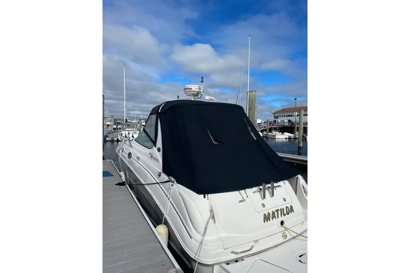 Slide: The Image of 2006 Sea Ray Sundancer 280 docked at marina under blue sky. - 1