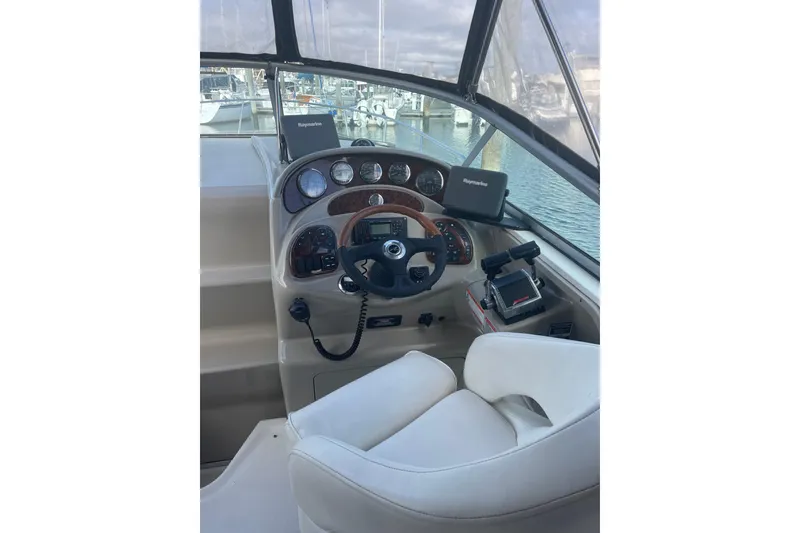 Slide: The Image of 2006 Sea Ray Sundancer 280 helm with Raymarine electronics, docked at marina. - 3