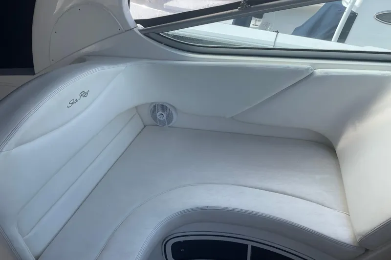 Slide: The Image of Interior seating of a 2006 Sea Ray Sundancer 280 boat, featuring white upholstery. - 4