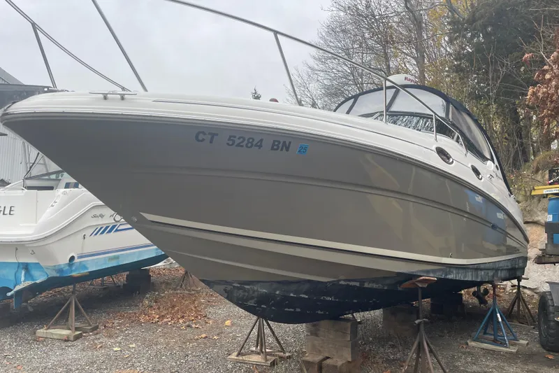 Slide: The Image of 2006 Sea Ray Sundancer 280 boat on stands, side view, outdoors. - 6