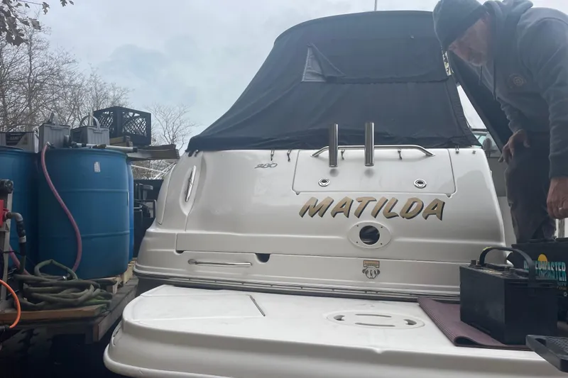 Slide: The Image of 2006 Sea Ray Sundancer 280 boat named Matilda, docked with maintenance equipment nearby. - 7