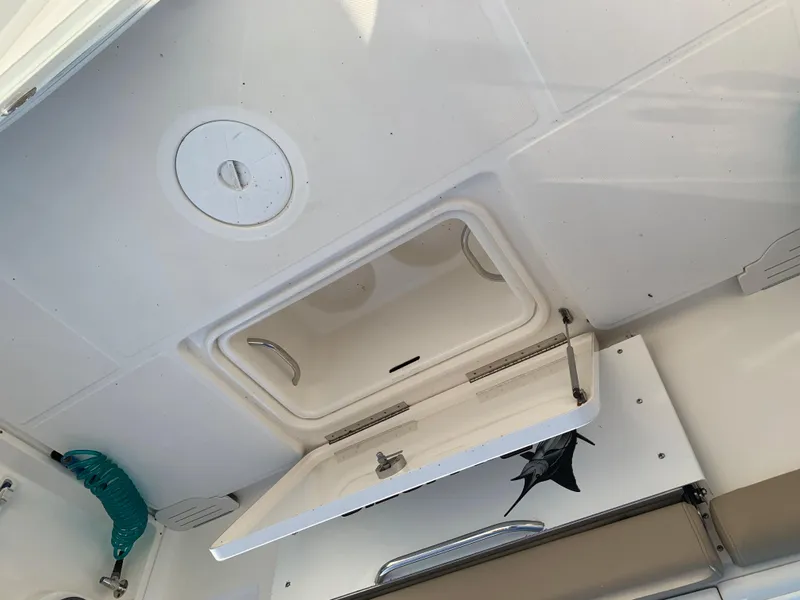 Slide: The Image of 2016 Key West 351 Billistic boat interior hatch and storage compartment. - 12