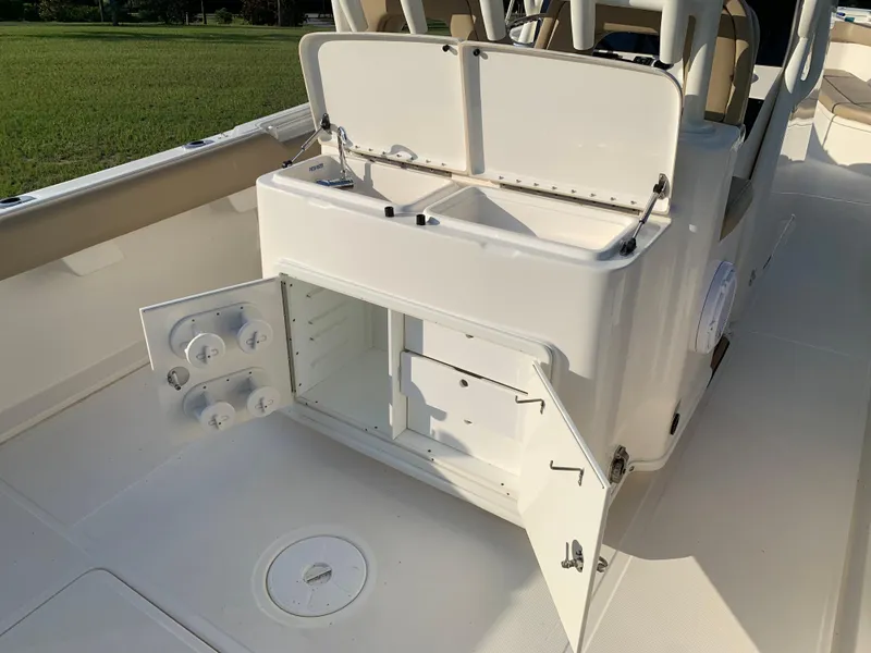 Slide: The Image of 2016 Key West 351 Billistic boat with open storage compartments. - 16