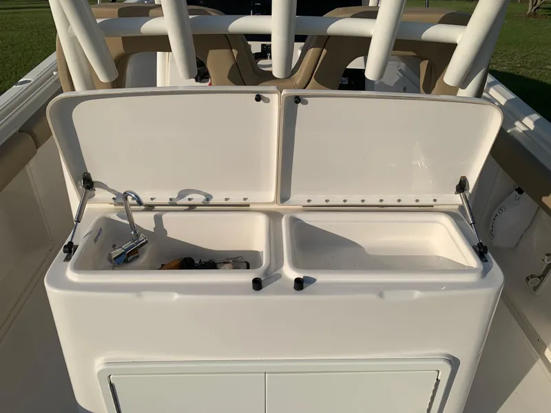 Slide: The Image of 2016 Key West 351 Billistic boat storage compartments open. - 17