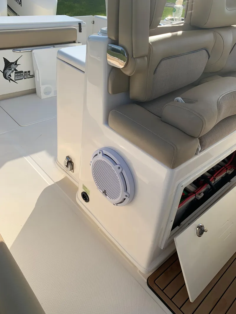 Slide: The Image of 2016 Key West 351 Billistic boat interior with seating and storage compartments. - 21