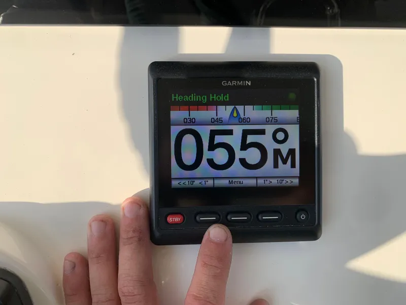 Slide: The Image of Garmin navigation display on 2016 Key West 351 Billistic boat showing heading hold at 055 degrees. - 24
