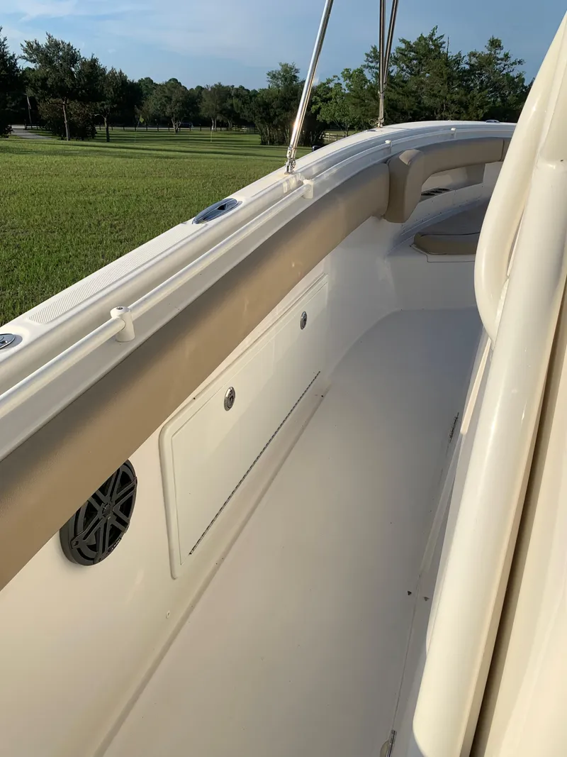 Slide: The Image of 2016 Key West 351 Billistic boat interior with storage compartments and speaker. - 25