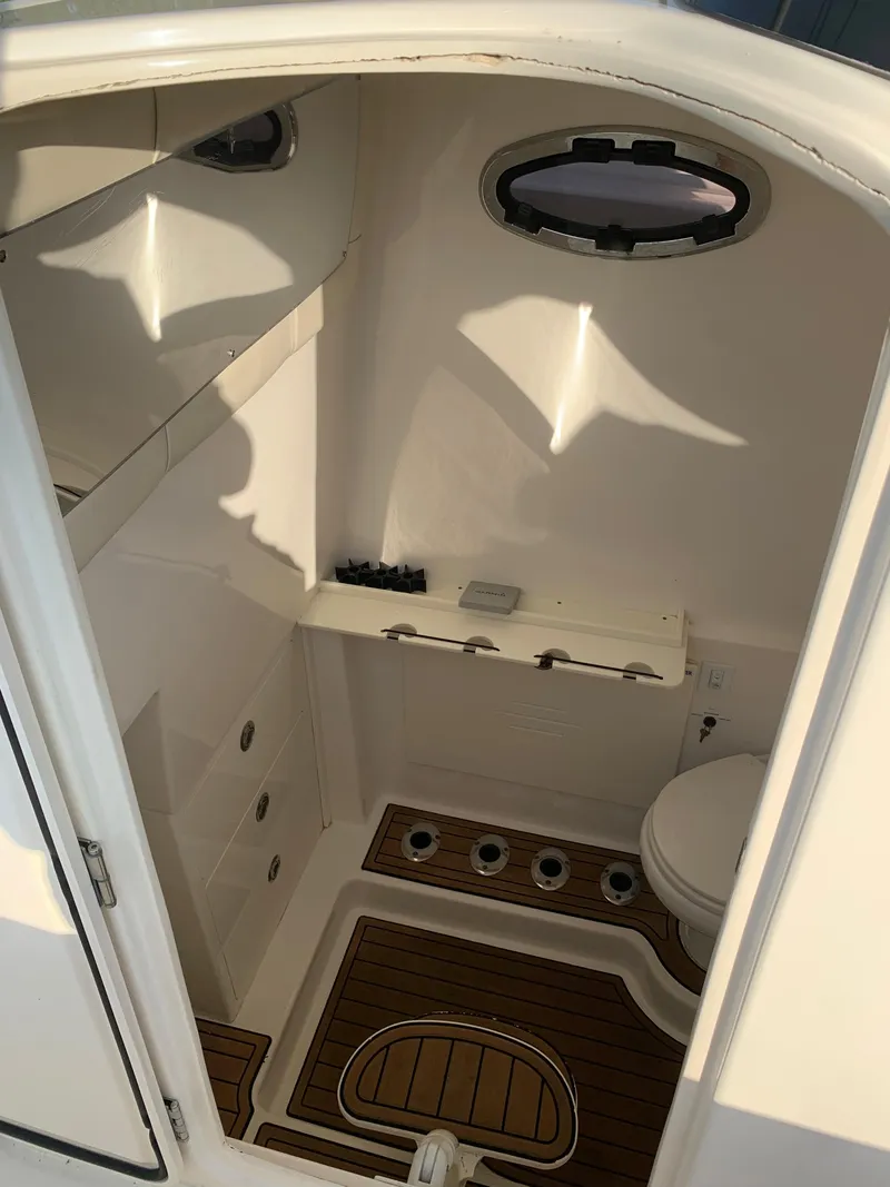 Slide: The Image of 2016 Key West 351 Billistic boat interior cabin with wooden flooring. - 28