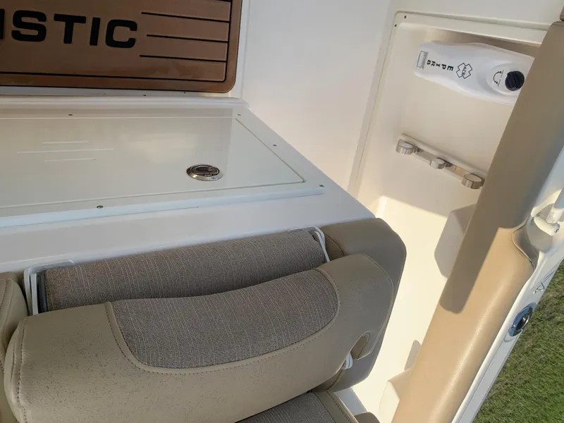 Slide: The Image of 2016 Key West 351 Billistic boat interior with cushioned seating and storage compartment. - 43