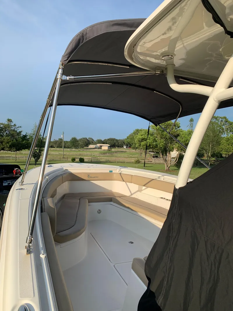 Slide: The Image of 2016 Key West 351 Billistic boat with canopy in a scenic outdoor setting. - 48