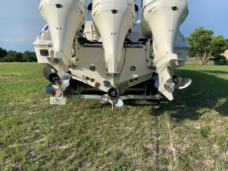 Slide: The Image of 2016 Key West 351 Billistic boat with triple outboard engines. - 6
