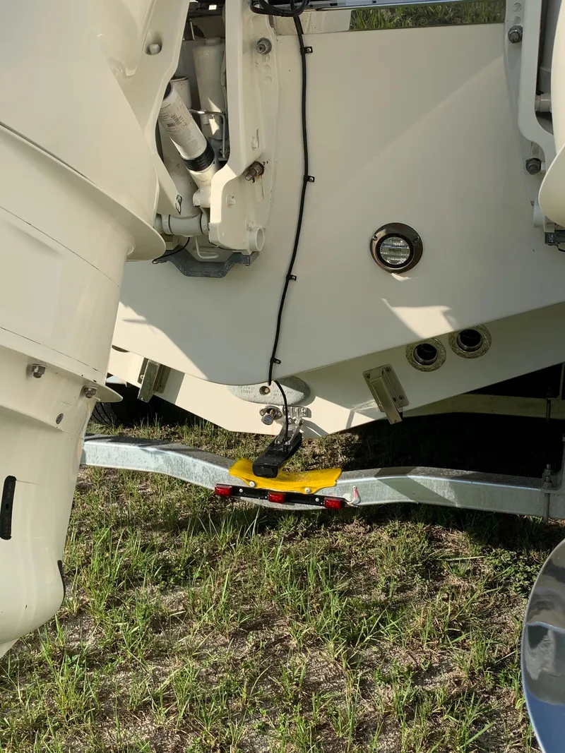 Slide: The Image of 2016 Key West 351 Billistic boat on trailer, rear view showing engine and hull. - 7