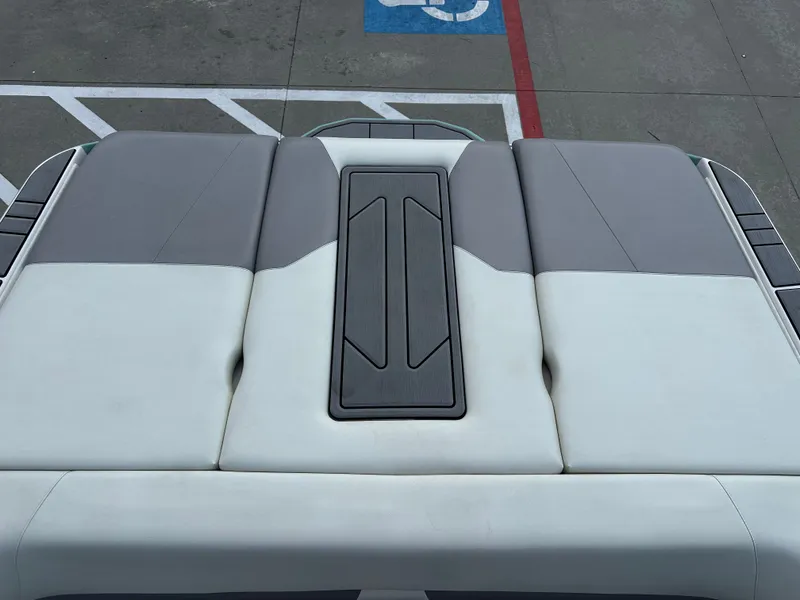 Slide: The Image of 2024 Moomba Max boat interior with gray and white seating, viewed from above. - 21