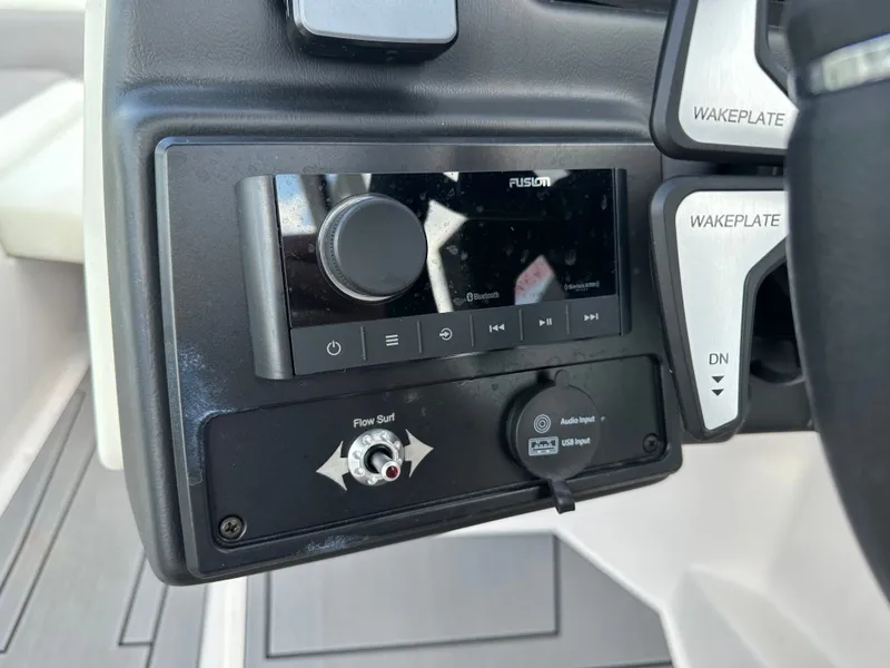 Slide: The Image of 2024 Moomba Max dashboard with audio controls and wakeplate adjustments. - 27