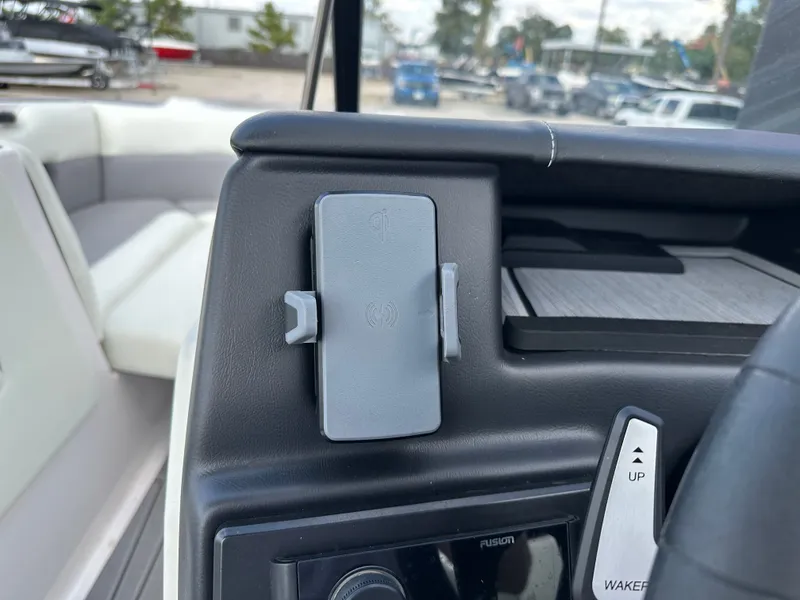 Slide: The Image of 2024 Moomba Max dashboard with phone holder and control panel. - 28