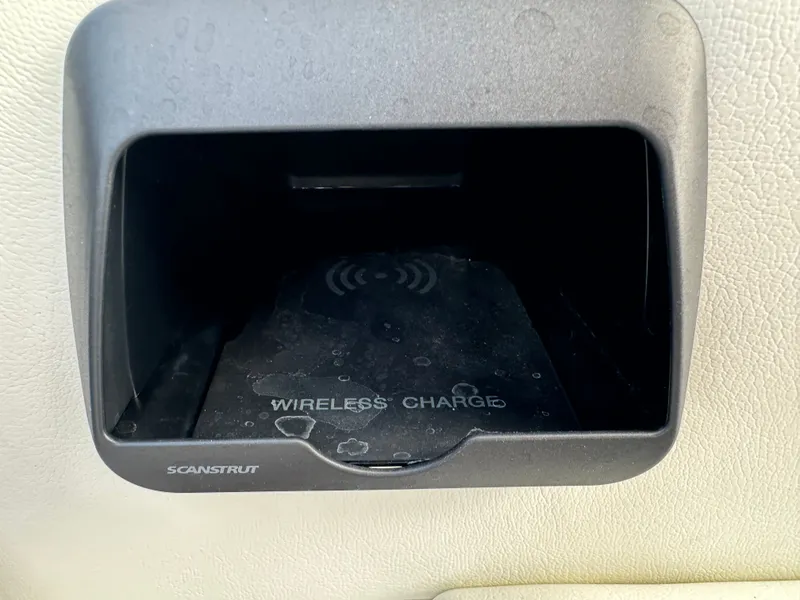 Slide: The Image of 2024 Moomba Max wireless charging compartment by Scanstrut, featuring a sleek design. - 34