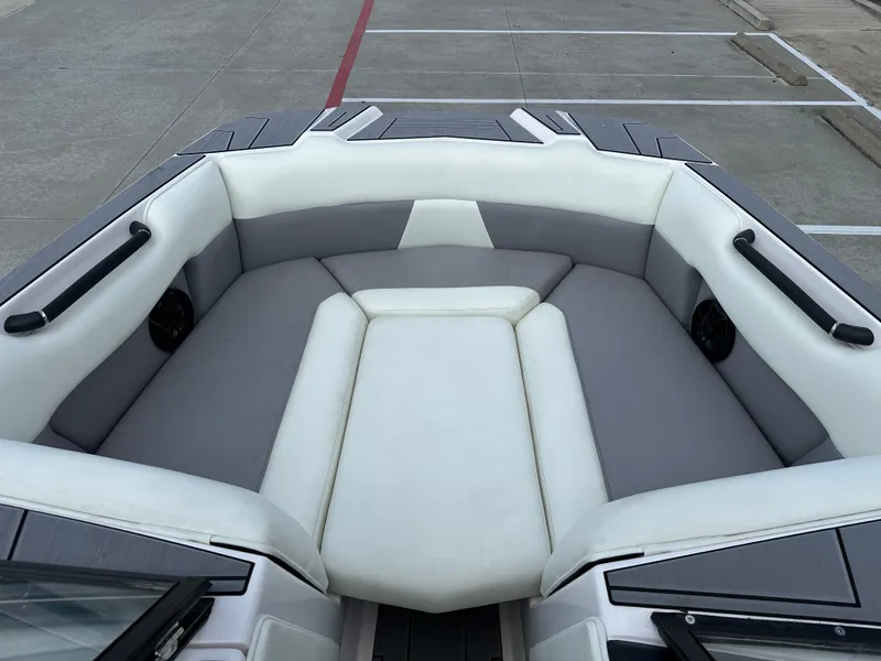 Slide: The Image of 2024 Moomba Max boat interior with gray and white seating, featuring sleek design and spacious layout. - 37