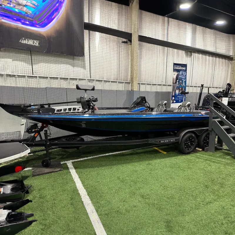 Slide: The Image of 2026 Skeeter ZXE20 boat displayed indoors. - 15
