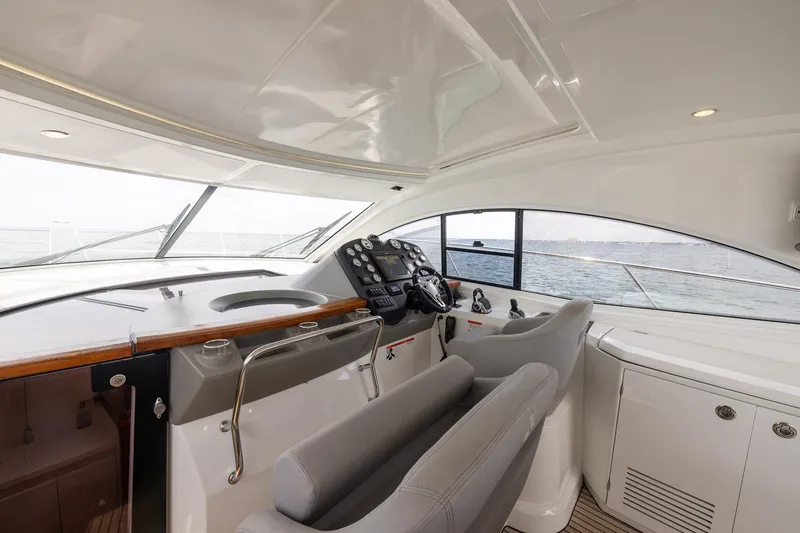 Slide: The Image of 2014 Beneteau Gran Turismo 44 yacht cockpit with modern controls and ocean view. - 12