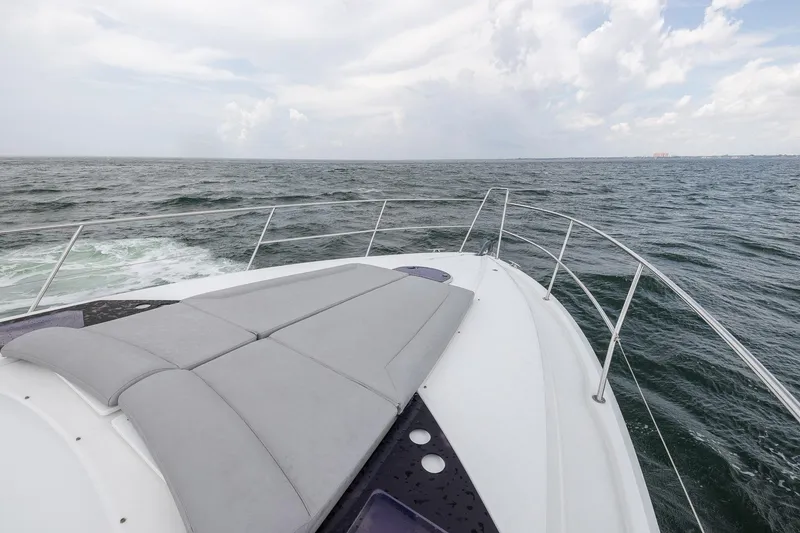 Slide: The Image of 2014 Beneteau Gran Turismo 44 yacht cruising on open sea under cloudy sky. - 15