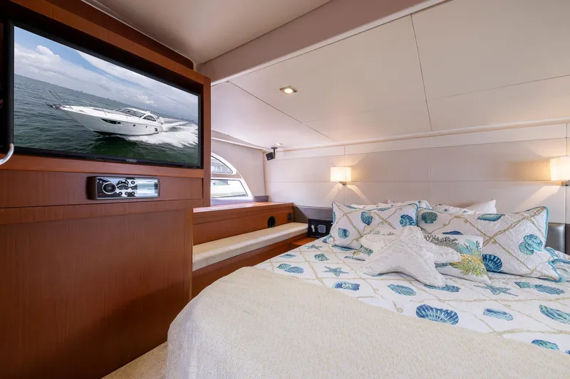 Slide: The Image of Luxurious bedroom interior of 2014 Beneteau Gran Turismo 44 yacht with cozy bedding and TV. - 19