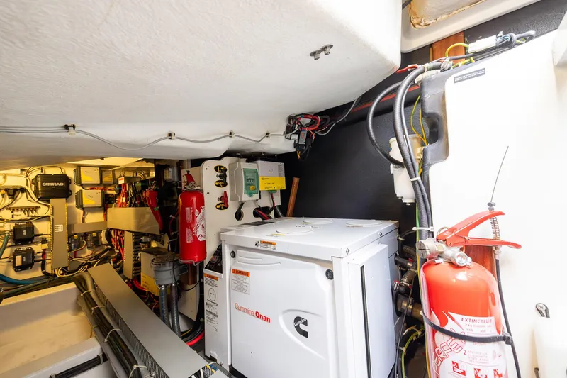 Slide: The Image of Engine room of 2014 Beneteau Gran Turismo 44 with Cummins Onan generator and safety equipment. - 29